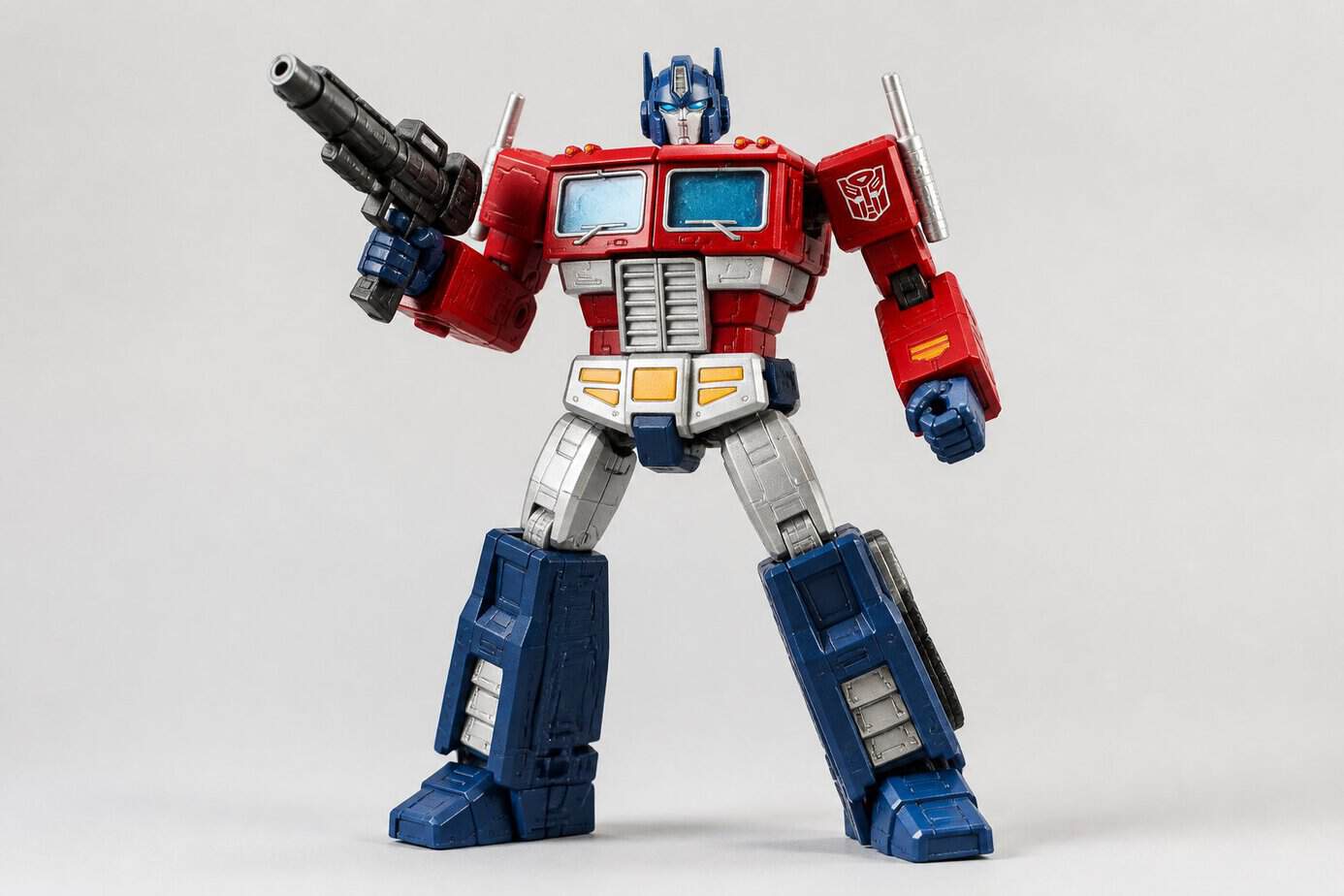 A detailed close-up of a classic Optimus Prime action figure from the 1980s standing against a plain background.
