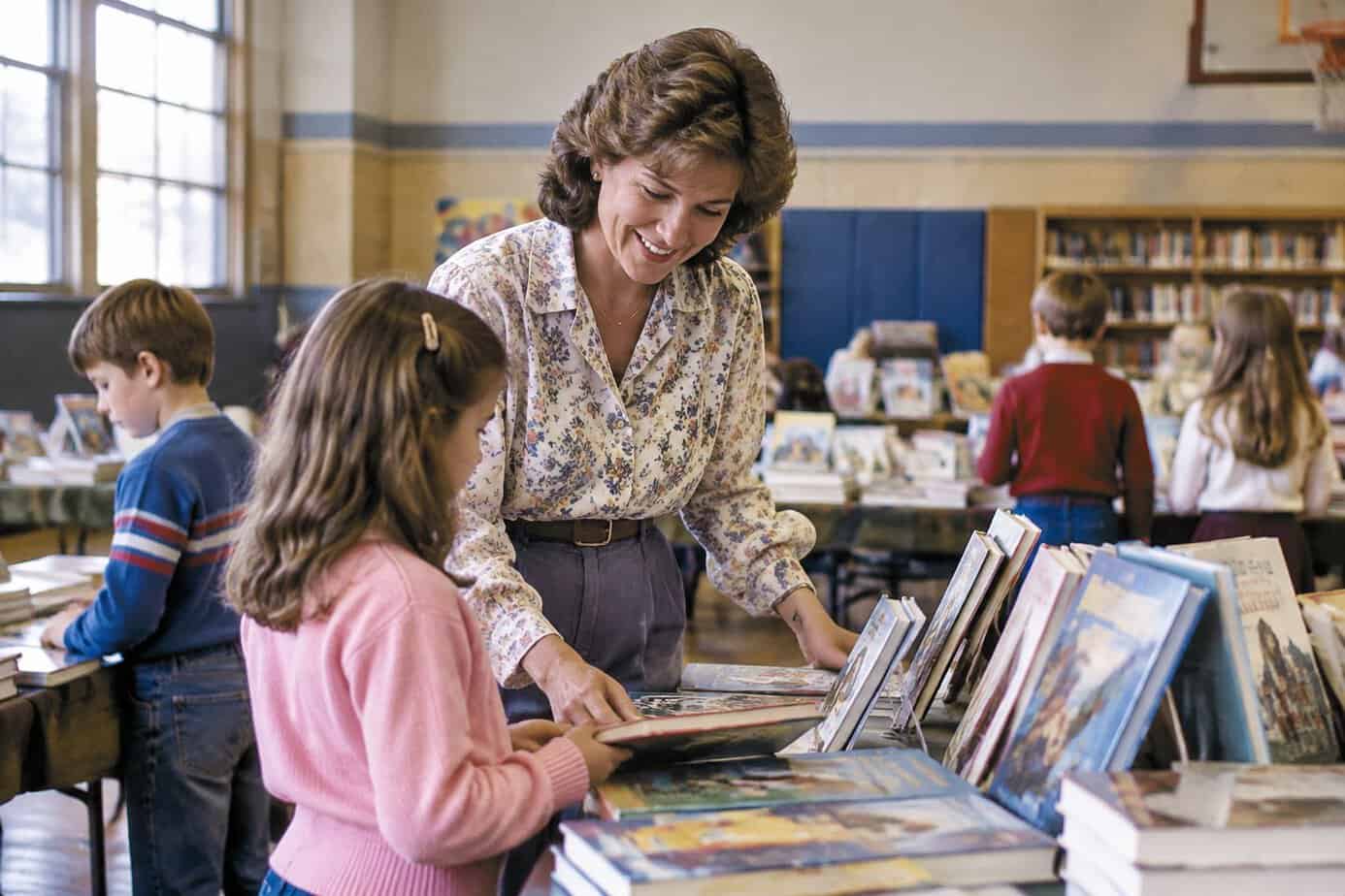 A 1980s mother volunteering at a school book fair